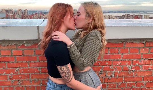 Russian lesbians on the roof of the house gently kiss and fuck each others holes